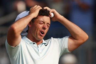 Rory McIlroy holds is head in anger after the 18th hole at the US Open