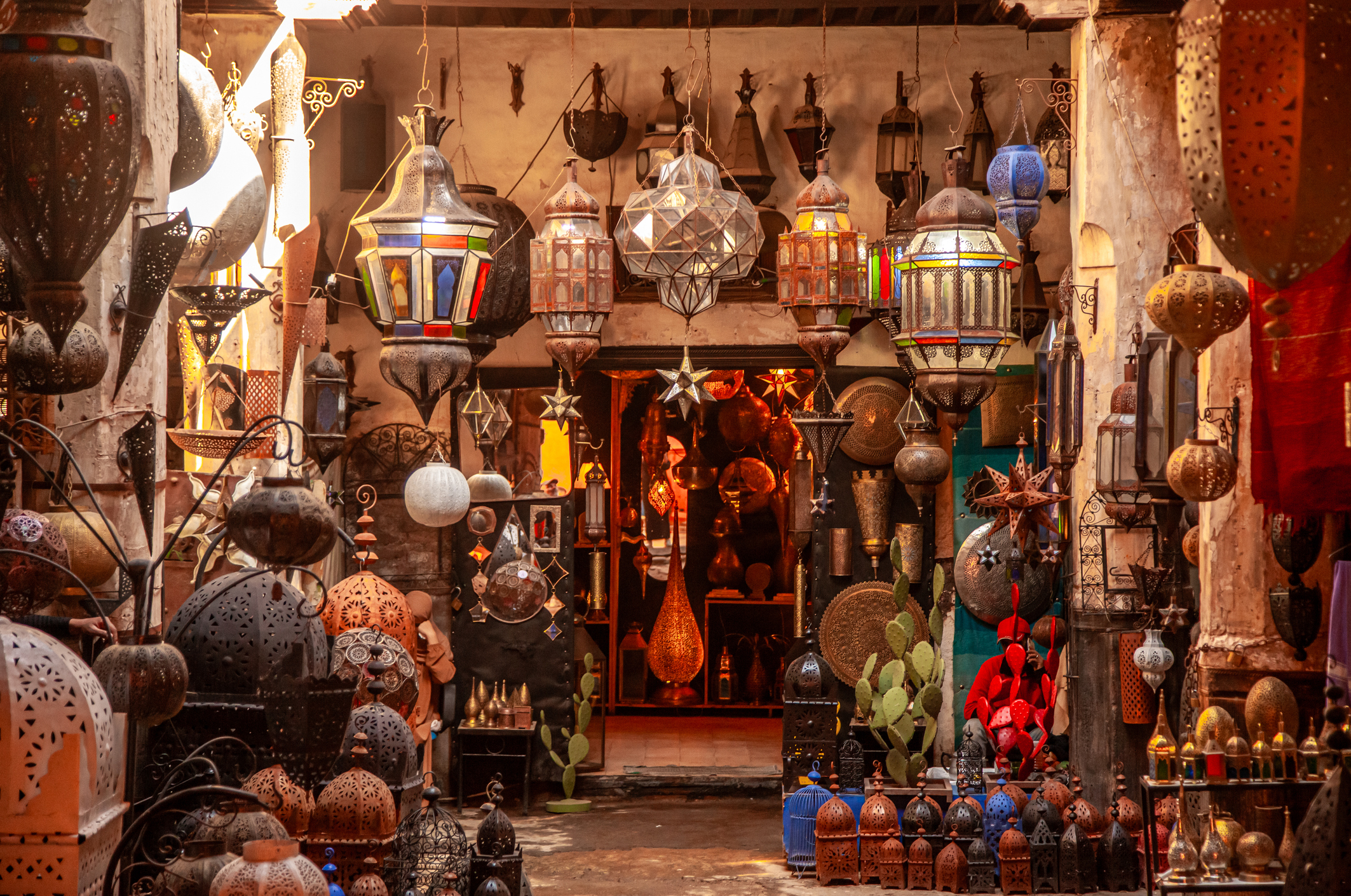 A Moroccan souk stacked with pendant lanterns in all sorts of stained glass colors.