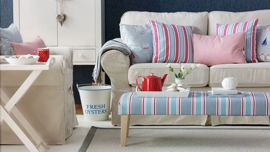 living room with white sofa set and cupboard