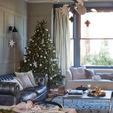 A Christmas decorated living room with a Christmas tree