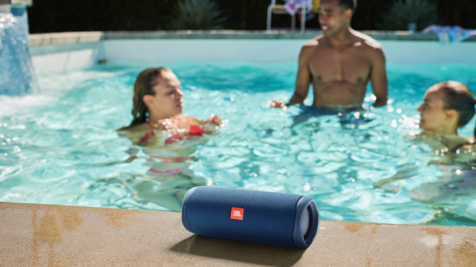 the JBL Flip 5 Bluetooth speaker by a pool