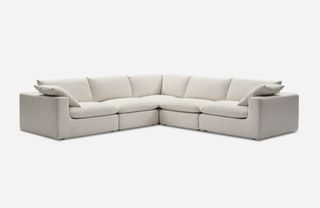 An off-white L-shaped sectional sofa
