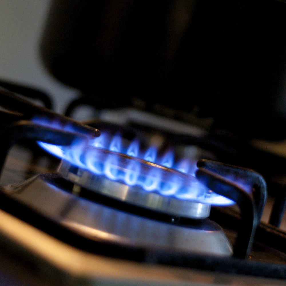 gas hob ring in grey colour with blue light
