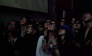Guests watch the show wearing 3D glasses