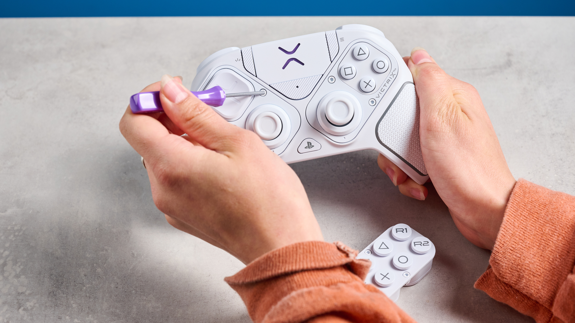 A white Turtle Beach Victrix Pro BFG Reloaded controller for the PS5