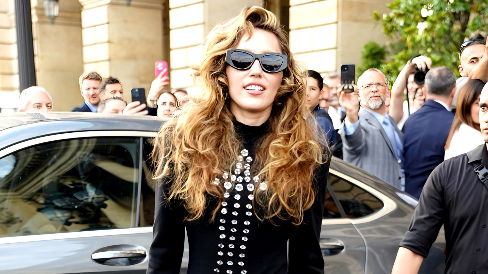 Miley Cyrus wears a vintage Patrick Kelly dress with Eiffel Tower-shaped studs on the front.
