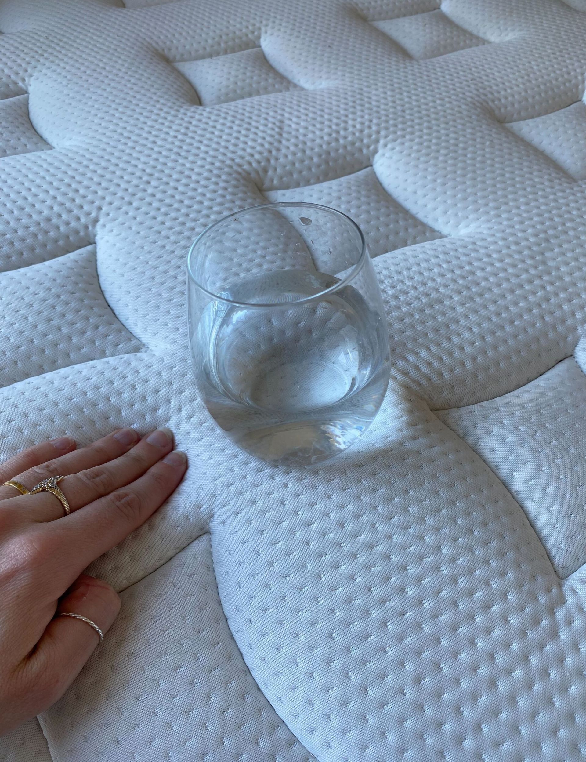 Mattress with glass of water on