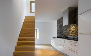 White wall with wooden stairway