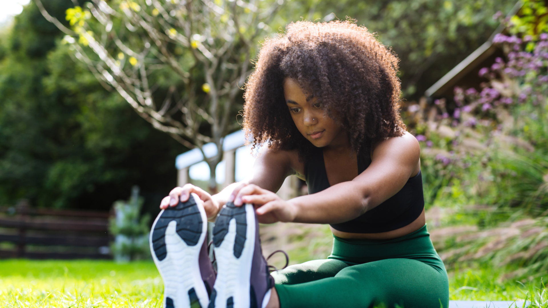 A woman doing a forward fold stretch