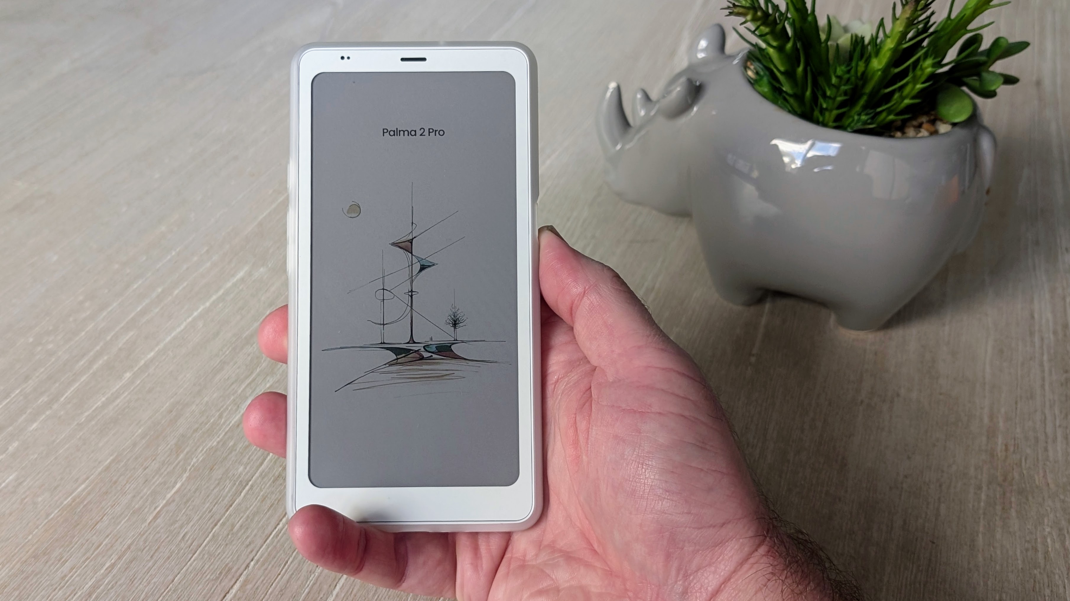Boox Palma 2 Pro not in flip case, held in a hand