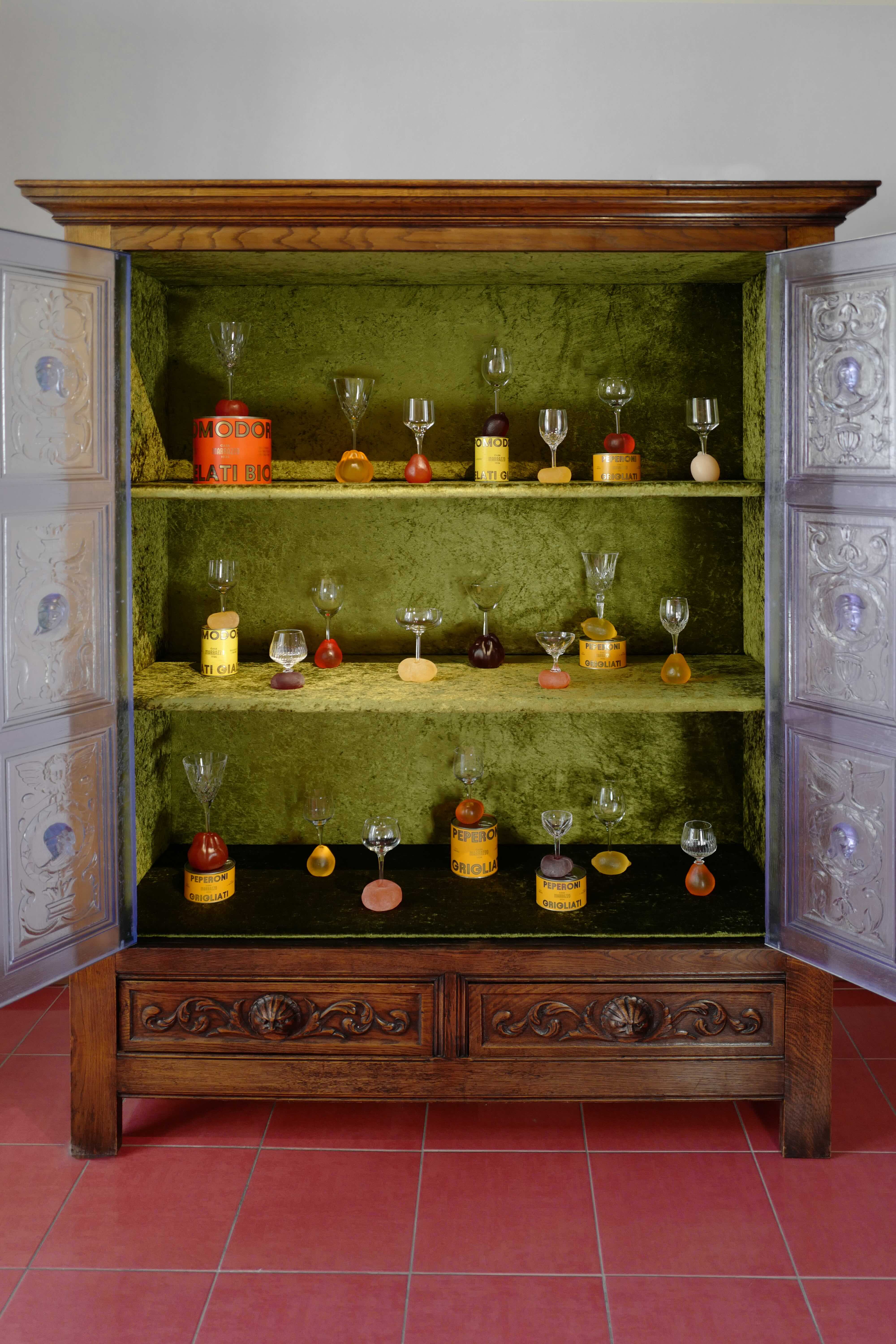 Glasses arranged inside a wooden cabinet