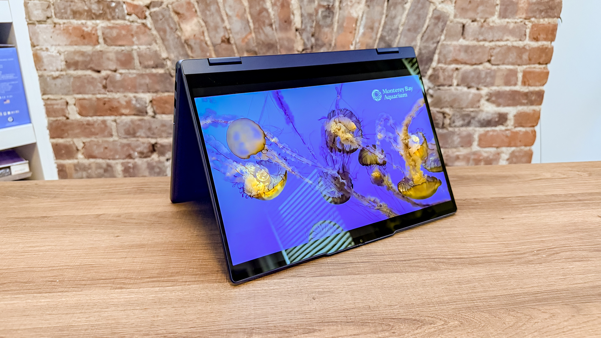 The Lenovo Chromebook Plus 2-in-1 Gen 10 in tent mode on a table
