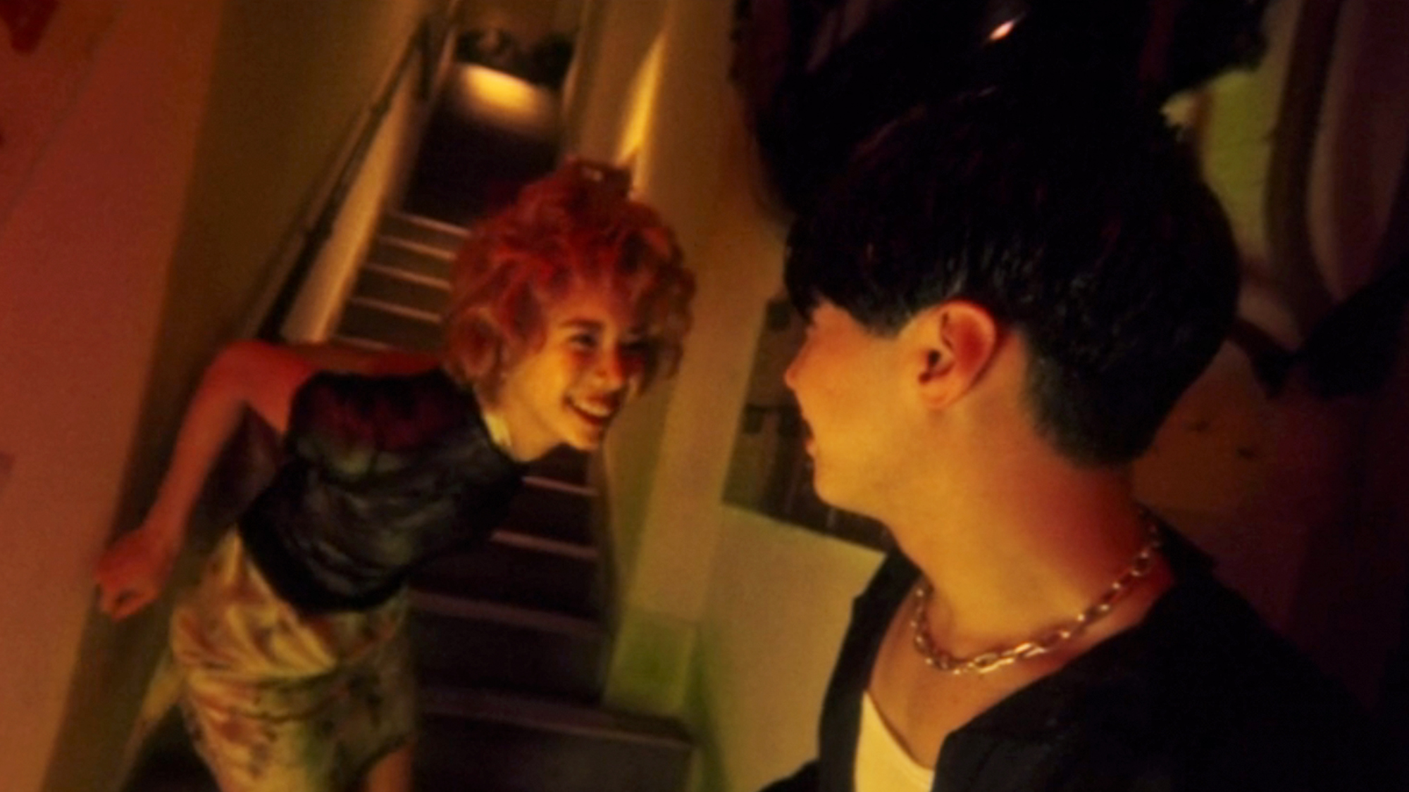 Two smiling characters in Fallen Angels.