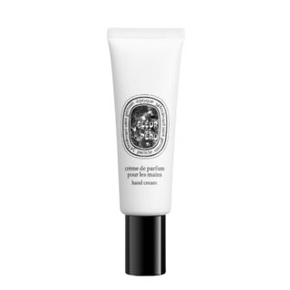 A product shot of the Diptyque Fleur de Peau hand cream on a white background