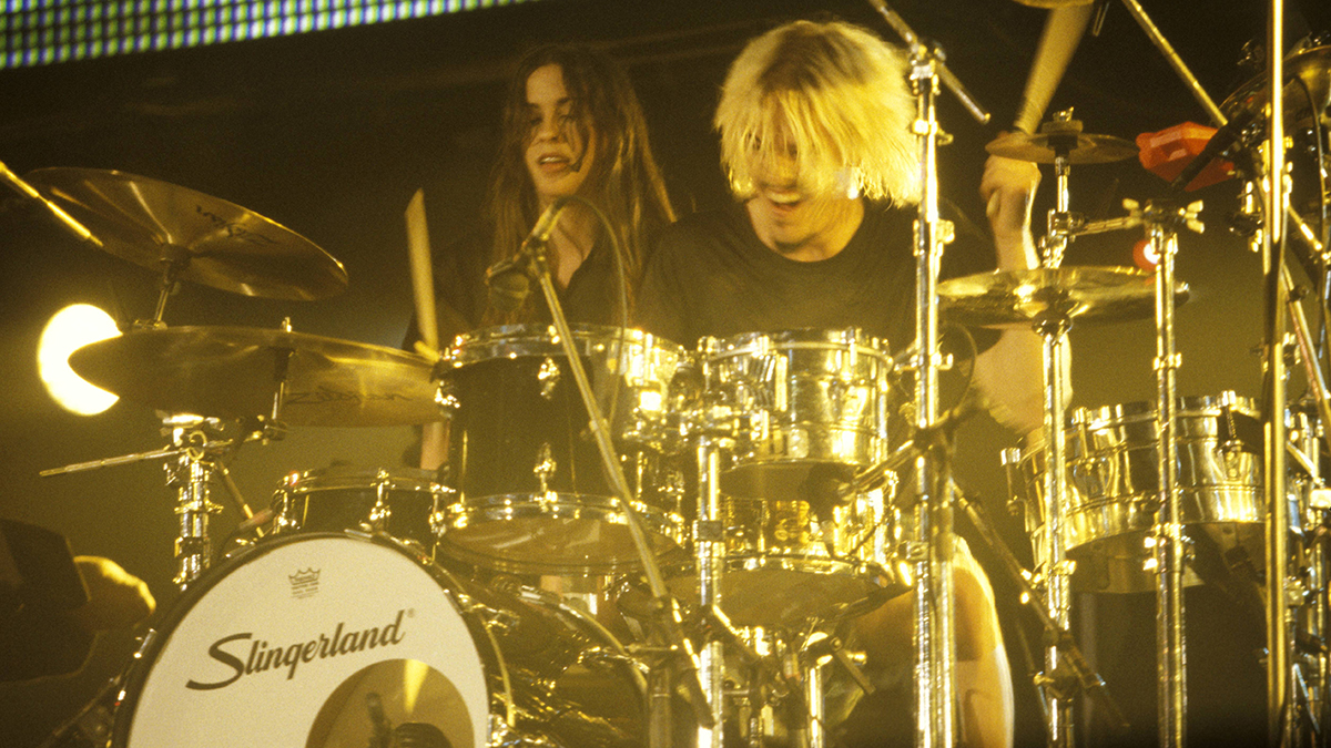 Alanis Morissette  performs ons tage with drummer Taylor Hawkins, circa 1995. (Photo by Mick Hutson/Redferns)
