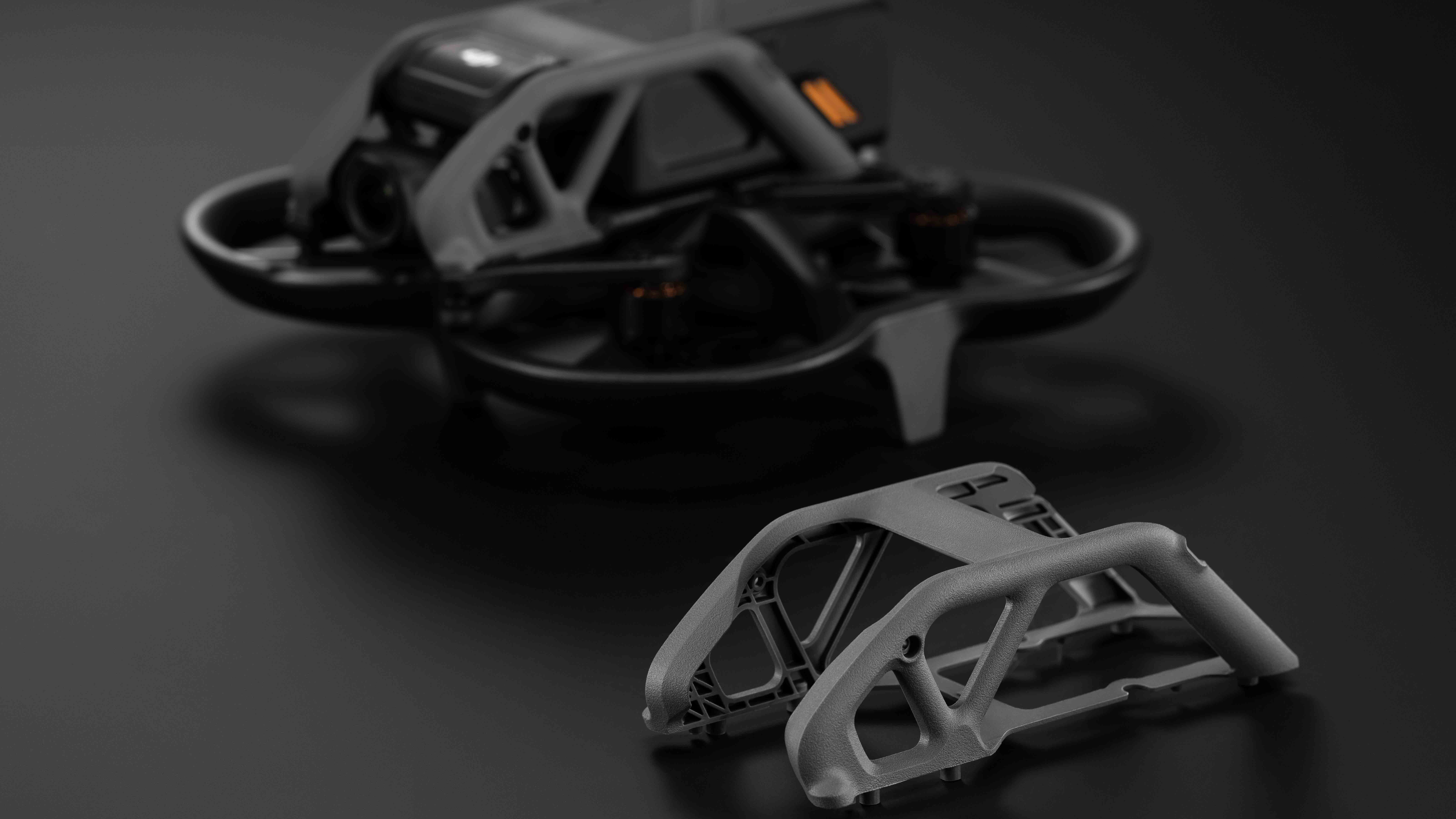 The DJI Avata drone next to a replacement body frame