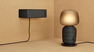 the sonos ikea symfonisk speakers with the bookshelf speaker on the right and the lamp speaker on the left