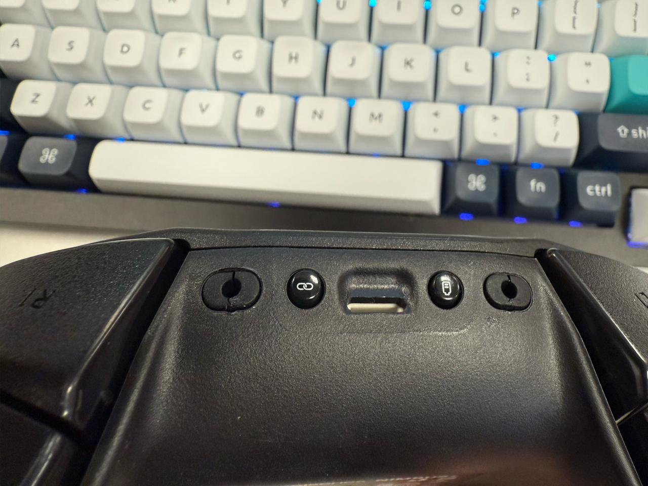 a photograph of the steelseries nimbus+ wireless controller showing the ripped rubber phone mount connection