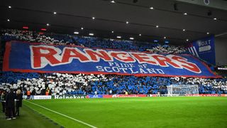 Rangers fans display a large banner in the crowd ahead of the UEFA Europa League group C football match between Rangers and Aris Limassol at the Ibrox Stadium in Glasgow on November 30, 2023.