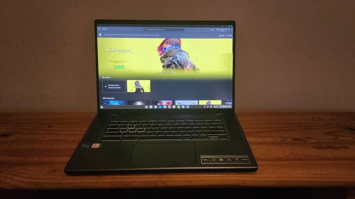 The Acer Chromebook 516 GE facing forward on a desk, showing the streaming page for Cyberpunk 2077.