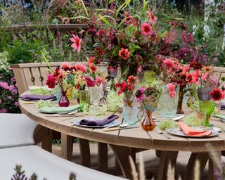 outdoor table setting with flowers and china