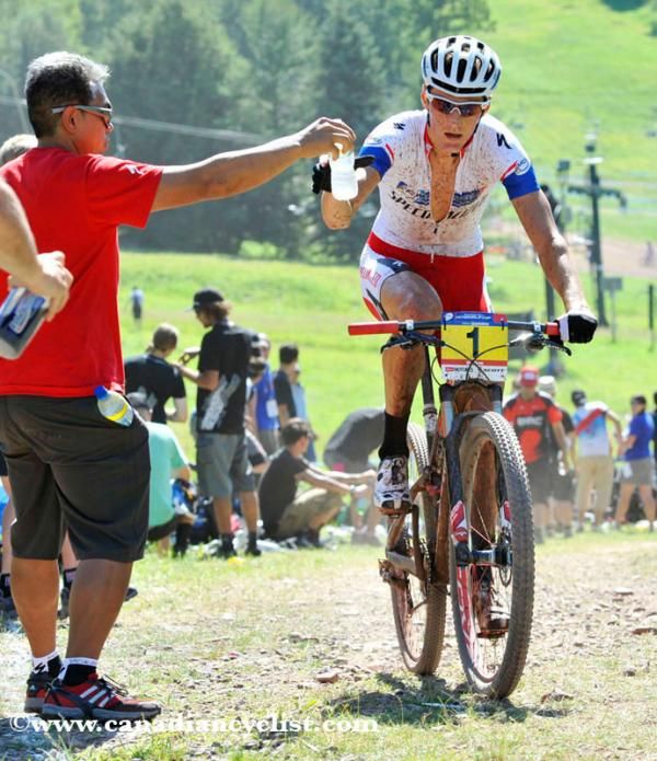 Jaroslav Kulhavy takes on water during a long hot race.