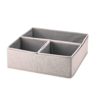 A grey clothes organizer box