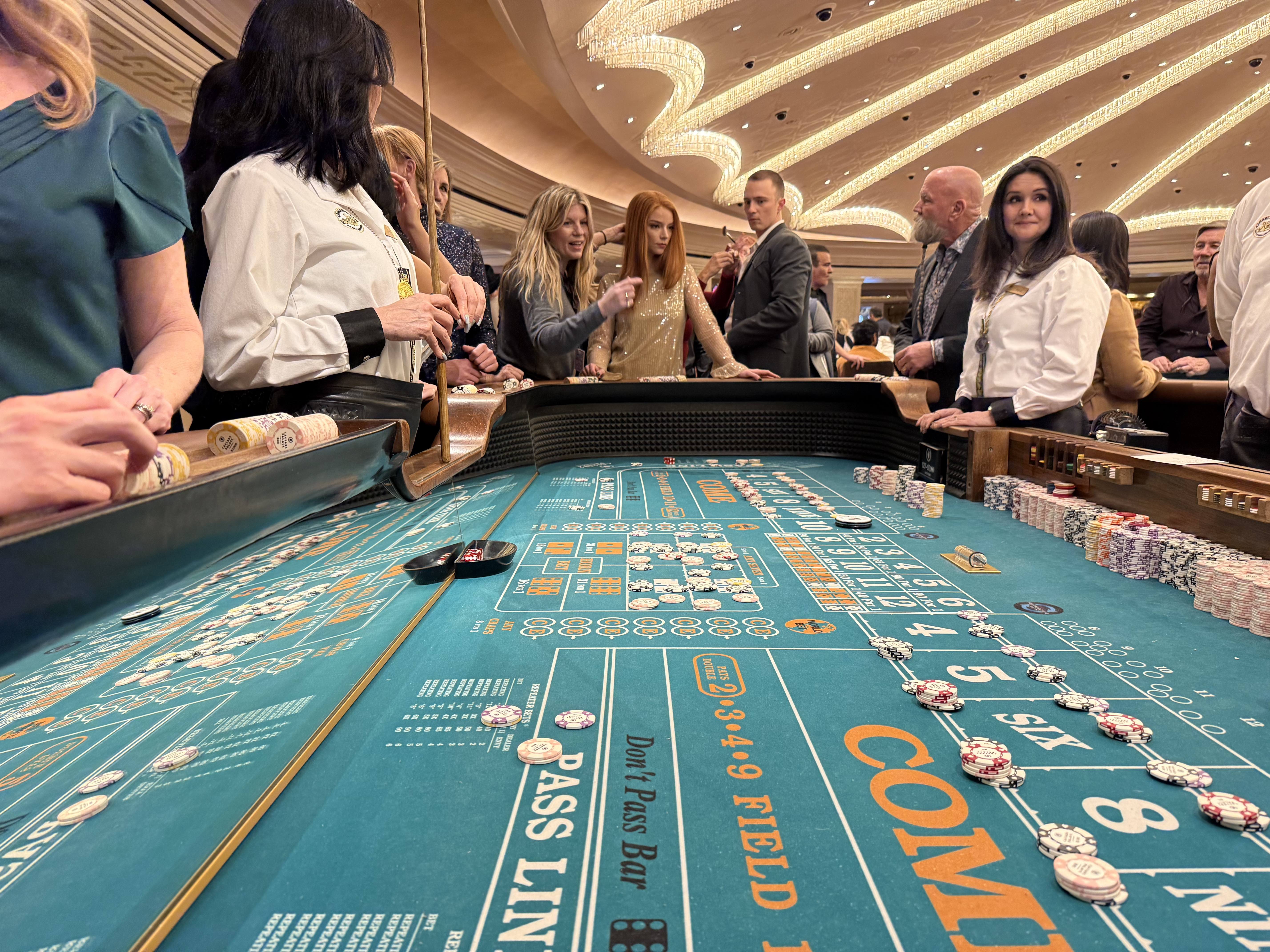 cassie pappas talks with anya taylor joy and drew starkey on the las vegas set of lucky
