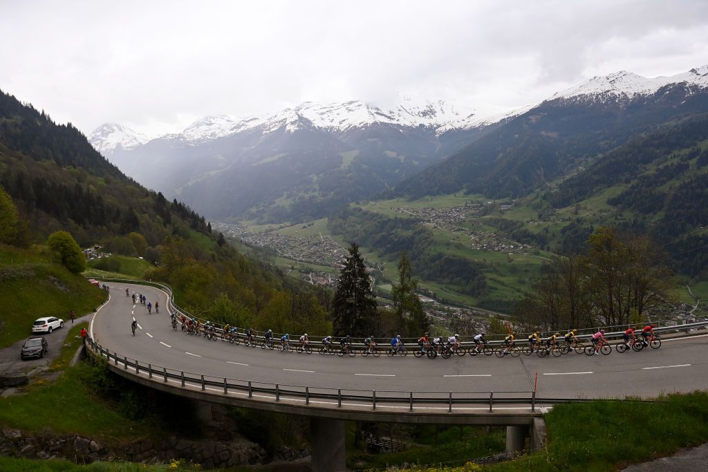 CRANSMONTANA SWITZERLAND MAY 19 Joo Almeida of Portugal and UAE Team Emirates White Best Young Rider Jersey Geraint Thomas of United Kingdom and Team INEOS Grenadiers Pink Leader Jersey and a general view of the peloton climbing to the Croix de Coeur 1363m during the 106th Giro dItalia 2023 Stage 13 a 75km stage from Le Chable to CransMontana Valais 1456m Stage shortened due to the adverse weather conditions UCIWT on May 19 2023 in CransMontana Switzerland Photo by Tim de WaeleGetty Images