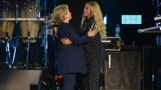 Beyoncé and Hillary Clinton hugging onstage