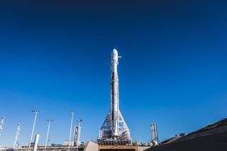 A SpaceX Falcon 9 rocket carrying the Paz radar-imaging satellite and two prototype broadband internet satellites stands atop Space Launch Complex 4E at the Vandenberg Air Force Station ahead of an attempted launch on Feb. 21, 2018. SpaceX has delayed the