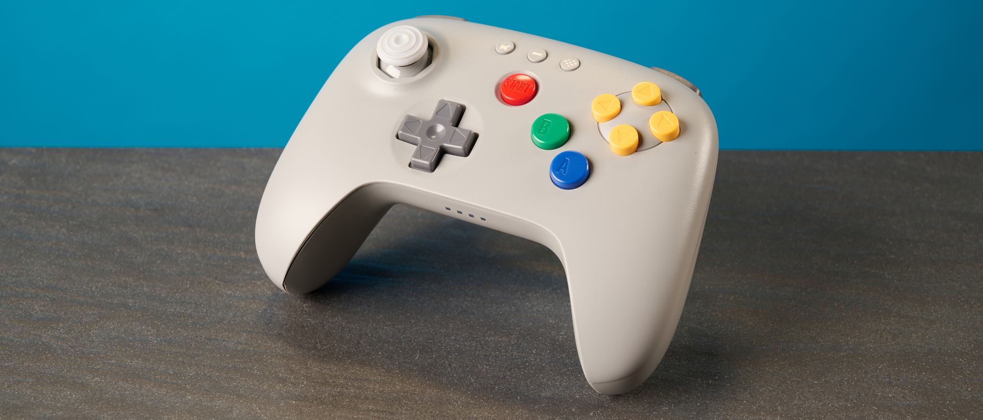 The 8BitDo 64 Controller against a blue background