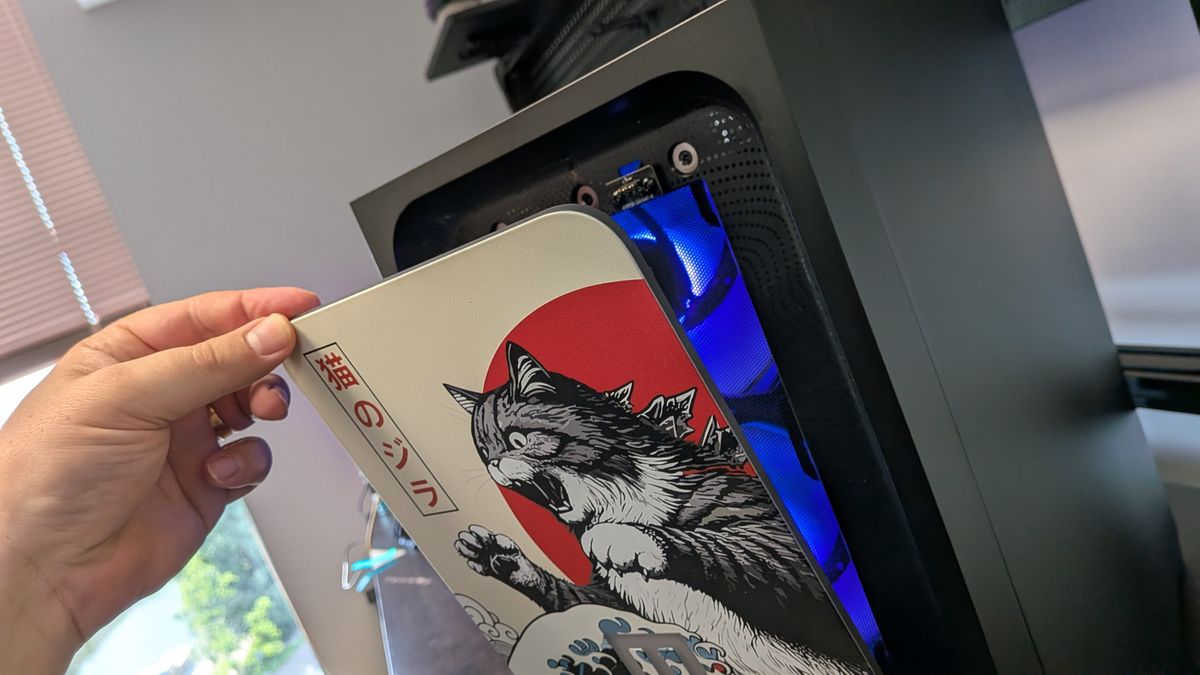 A photo of a Maingear MG-1 Mk.II gaming PC, showing the removal of the front panel