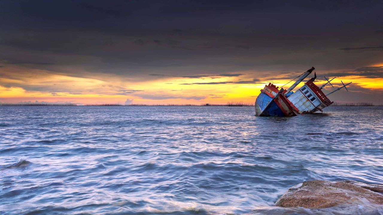 tugboat sinking in ocean