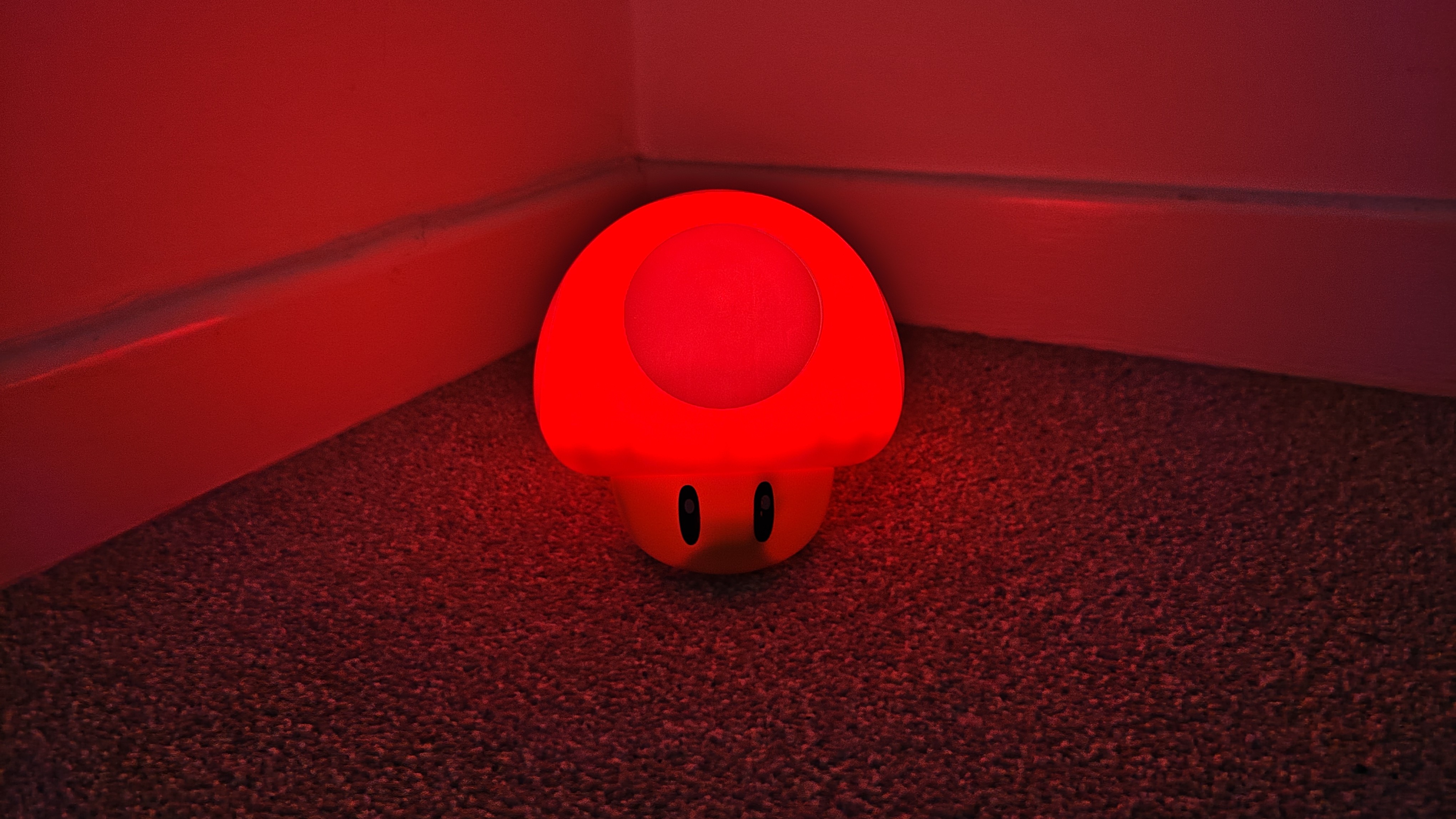 Paladone Super Mario Mushroom lamp on a carpeted floor