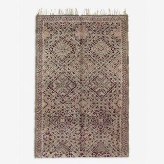 A vintage patterned rug with tassels from Lulu and Georgia