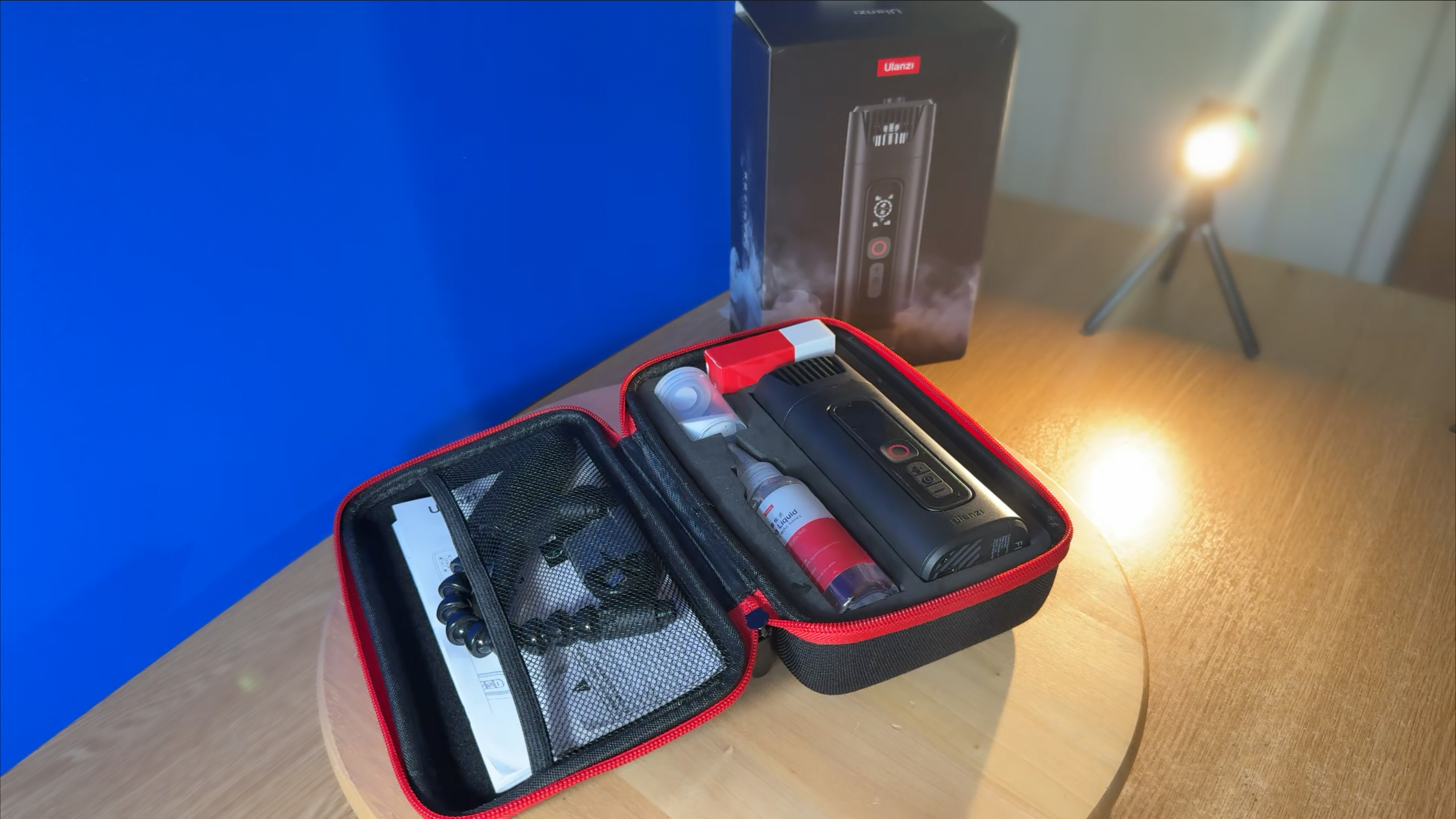 Shot of an open carry case containing the Ulanzi Filmog Ace, some fuel and a webbed pocket full of plastic modifier tubes