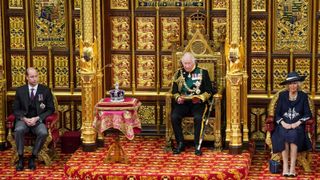 Britain's Prince Charles, Prince of Wales (2nd R) reads the Queen's Speech as he sits by the Imperial State Crown (2nd L), Britain's Camilla, Duchess of Cornwall (R) and Britain's Prince William, Duke of Cambridge (L) in the House of Lords chamber, during the State Opening of Parliament, at the Houses of Parliament, in London, on May 10, 2022