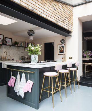 Kitchen island breakfast bar with pink bar stools