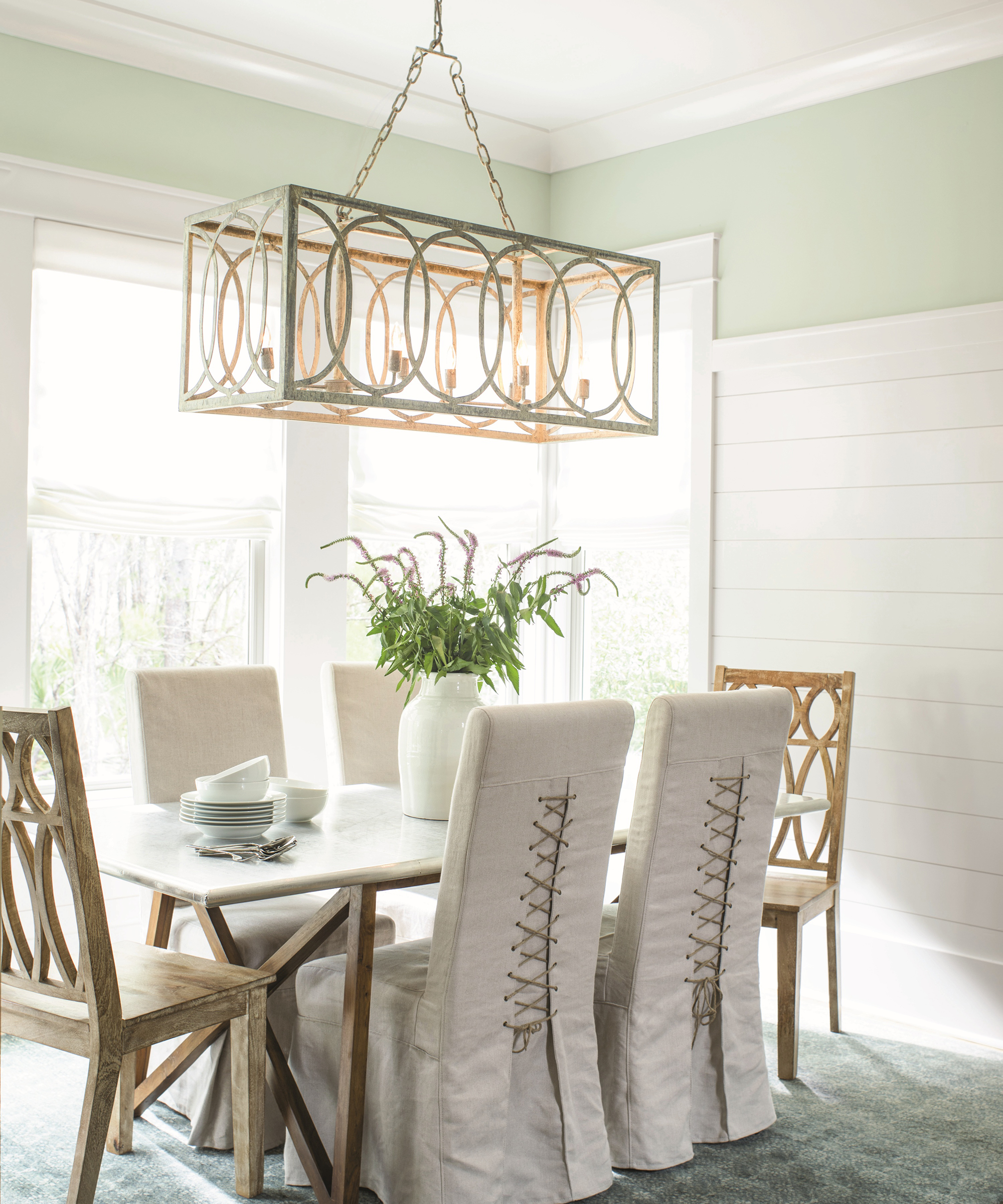 A grey dining room idea with corset style fastened chairs