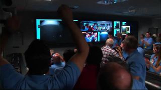 The first Mars photos from NASA's Curiosity rover prompt a huge celbration by the rover's mission support team at NASA's Jet Propulsion Laboratory in Pasadena, Calif., just minutes after the rover's Aug. 5 PDT, 2012 landing.