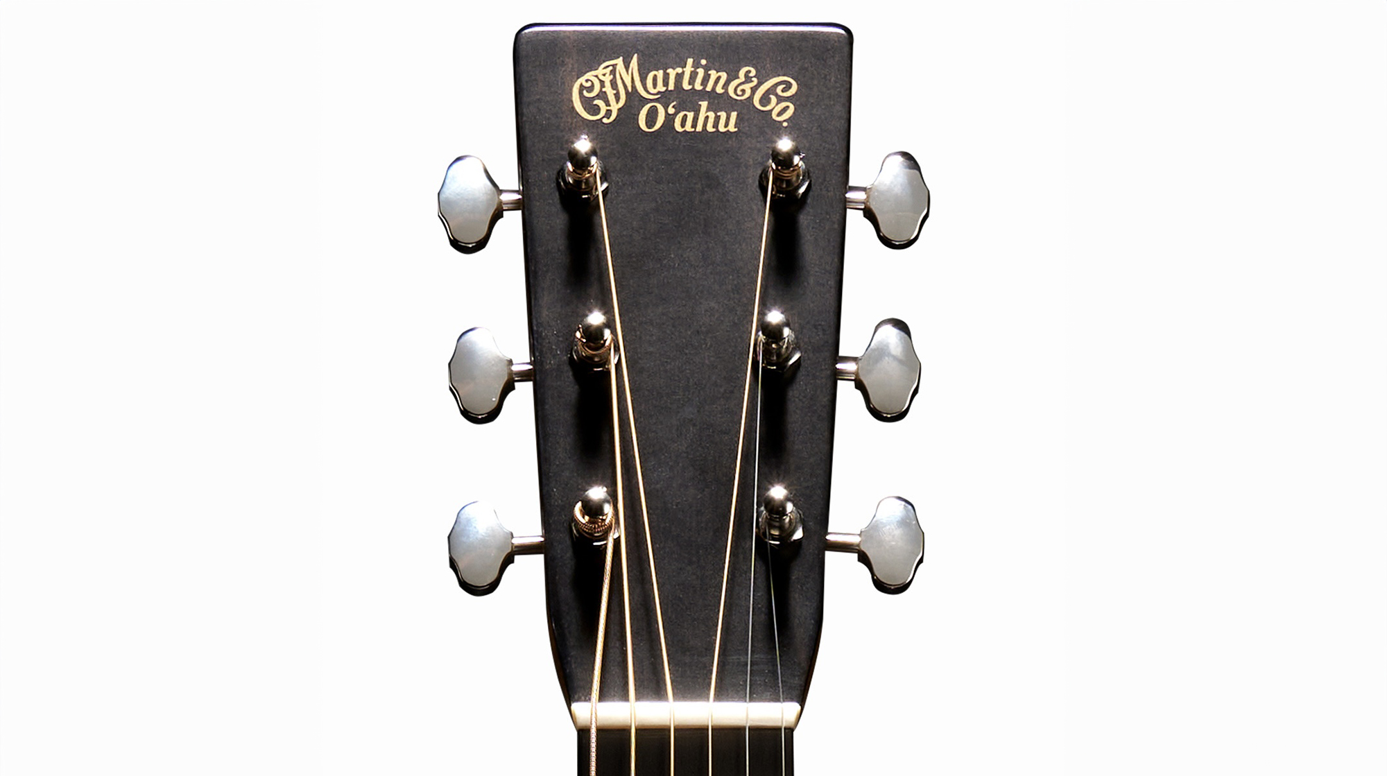 A photo showing the front of the headstock of a Martin O&#039;ahu HG-28 acoustic guitar