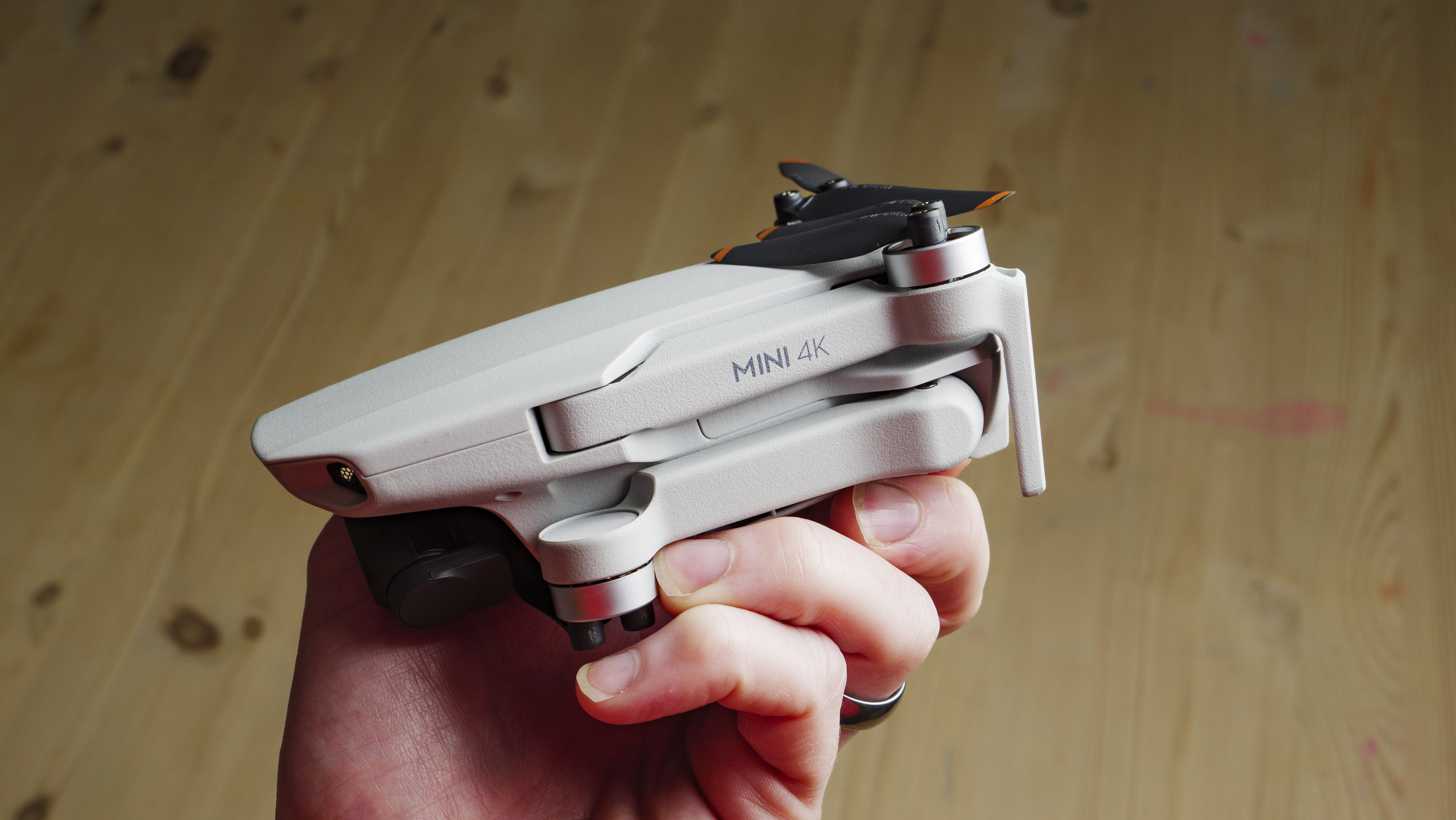 DJI Mini 4K beginner drone folded away and in the hand