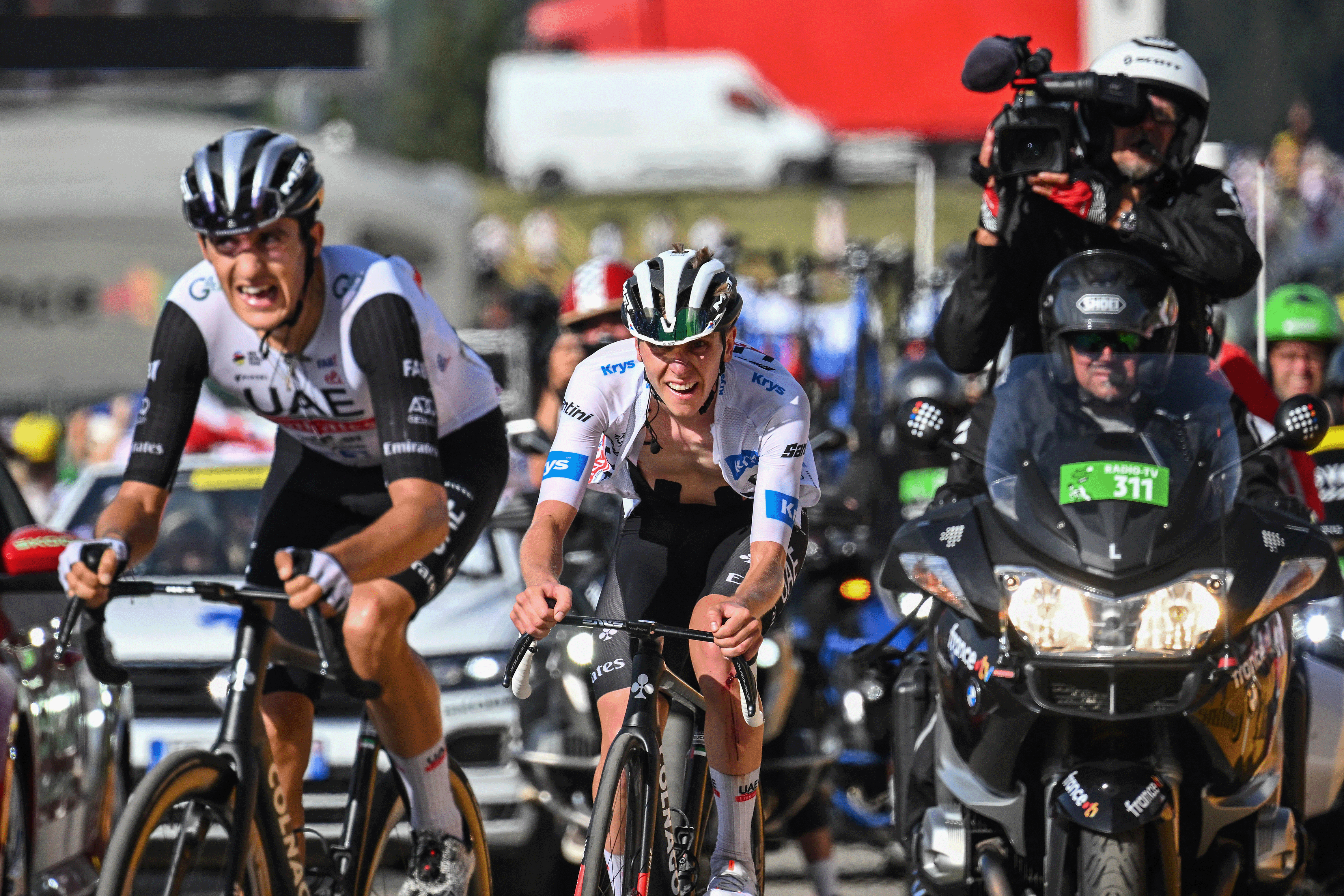 UAE Team Emirates' Slovenian rider Tadej Pogacar wearing the best young rider's white jersey (R) and UAE Team Emirates' Spanish rider Marc Soler (L) cycle in the ascent of Col de la Loze in the final kilometres of the 17th stage of the 110th edition of the Tour de France cycling race, 166 km between Saint-Gervais Mont-Blanc and Courchevel, in the French Alps, on July 19, 2023. (Photo by Marco BERTORELLO / AFP) (Photo by MARCO BERTORELLO/AFP via Getty Images)