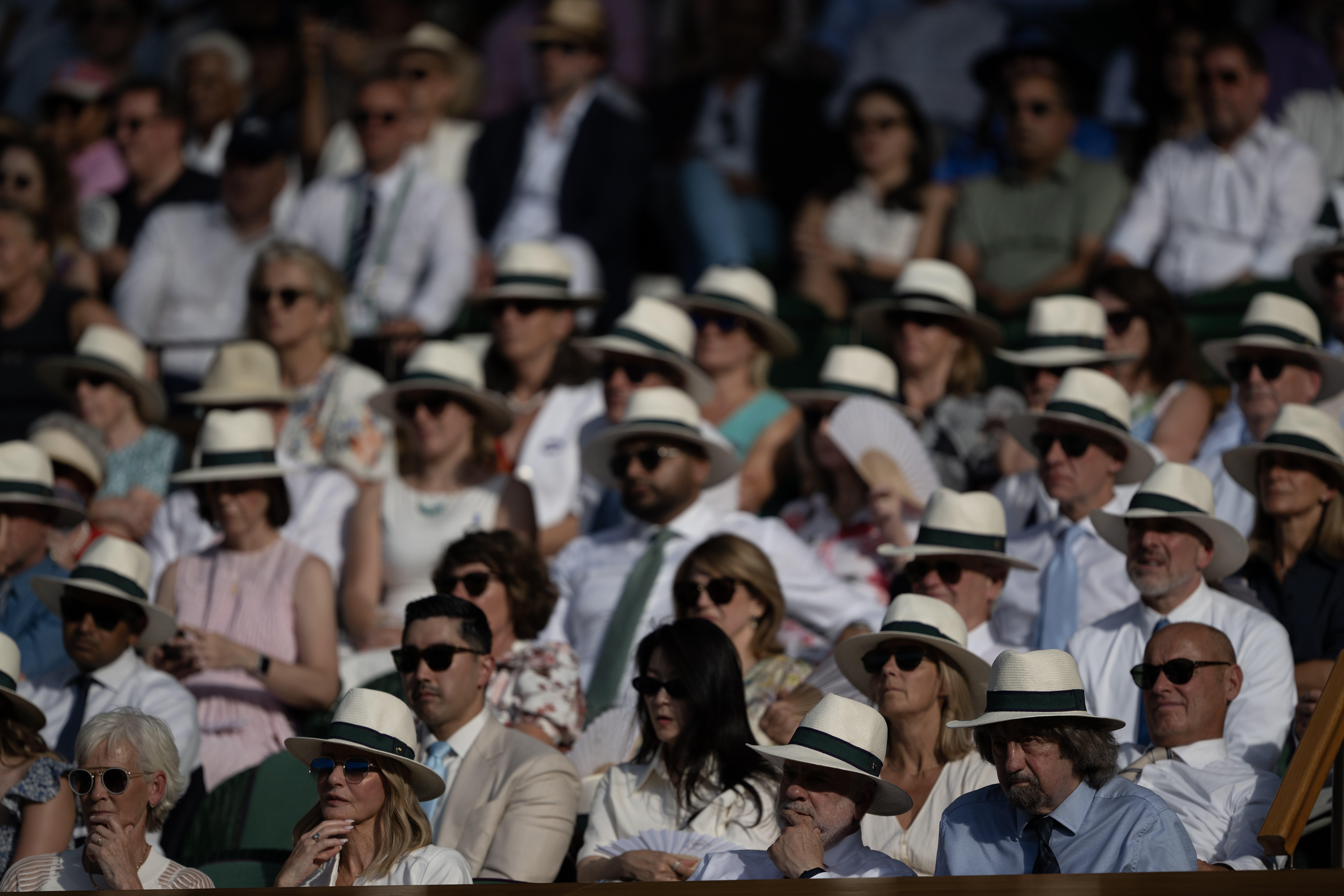 Guests in the Wimbledon Royal box wearing Panama hats