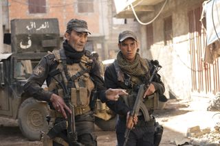 Suhail Dabbach as “Major Jaseem” and Adam Bessa as “Kawa” in Mosul, one of the best Netflix war movies