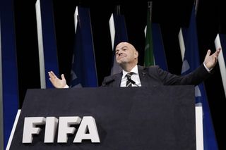Gianni Infantino gestures to the audience at the FIFA congress in Paris