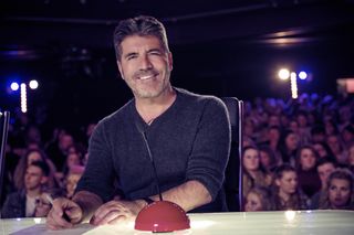Simon Cowell sitting behind his buzzer on Britain's Got Talent