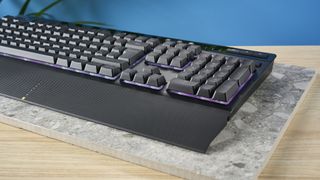 A black Corsair K55 RGB Pro wired gaming keyboard with rubber dome switches