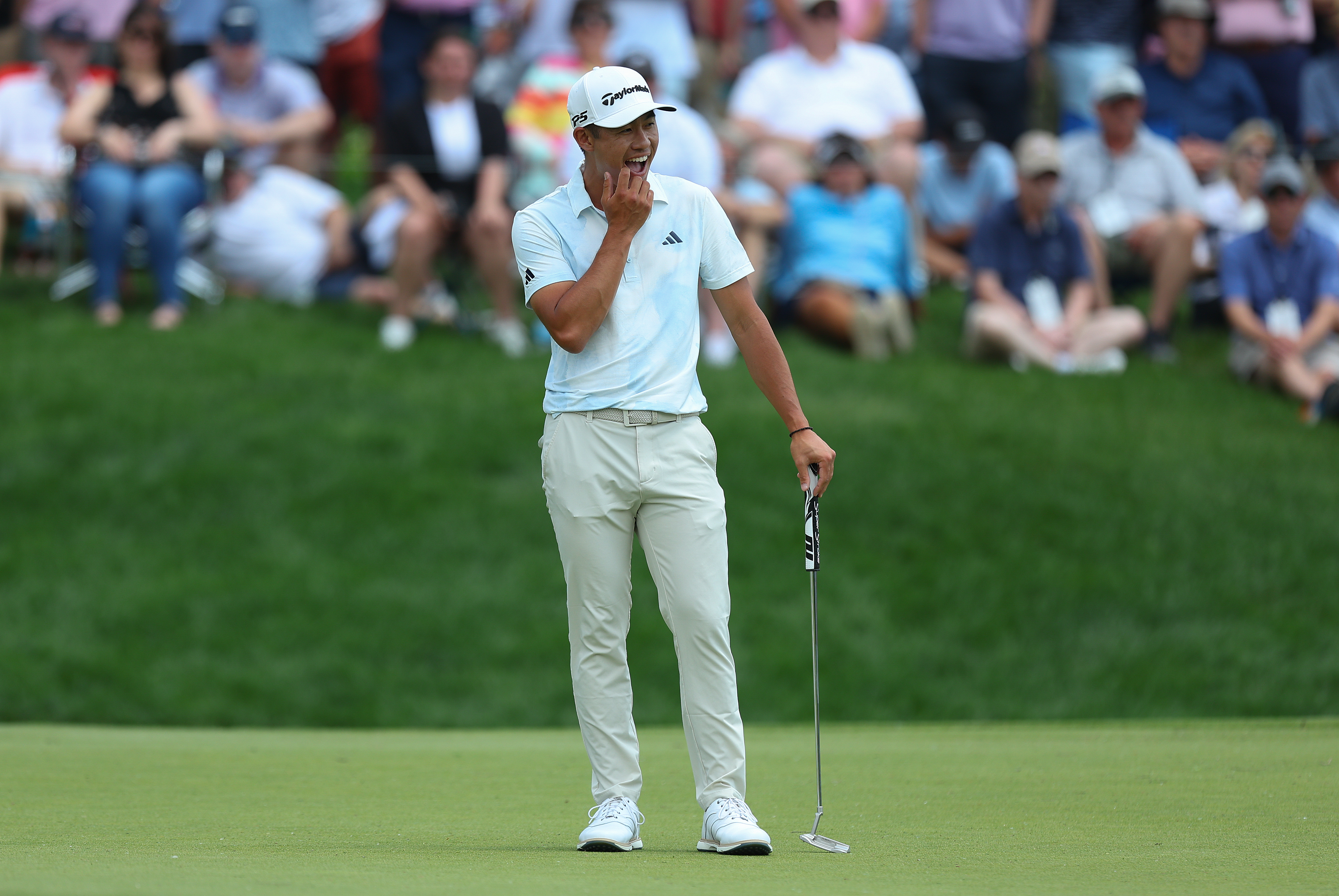 Collin Morikawa reacts to a missed putt